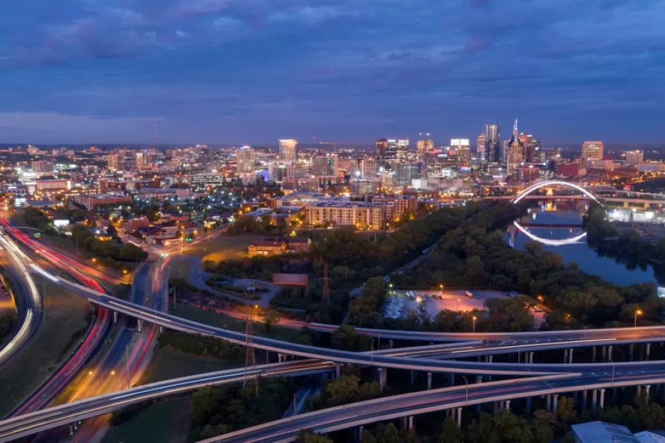 Pink light before morning dawn sun reflects on clouds over downtown Nashville TN